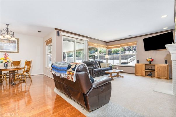 Dining room, Fireplace, Interior, Living room, Recessed Lighting, Wood Texture Flooring