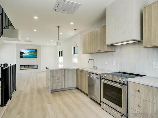 Fireplace, Interior, Kitchen, Pendant Lights, Recessed Lighting, Stainless Steel Appliances, Wood Texture Flooring