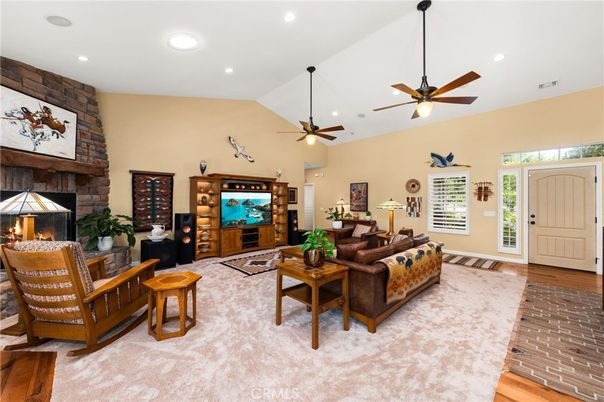 Fireplace, Interior, Living room, Recessed Lighting, Stone Walls, Wood Texture Flooring