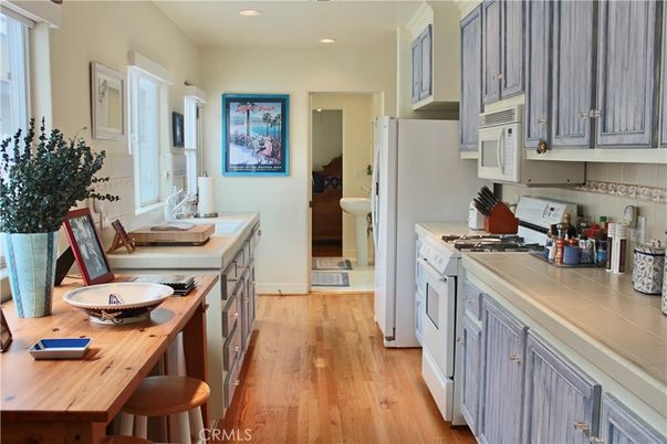 Interior, Kitchen, Recessed Lighting, Tile Countertops, Wood Texture Flooring