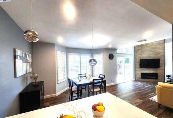 Dining room, Fireplace, Interior, Pendant Lights, Recessed Lighting, Stone Walls, Wood Texture Flooring