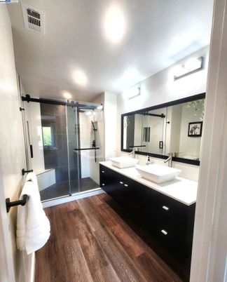 Bathroom, Dual Sink Vanities, Glass Shower, Interior, Wood Texture Flooring