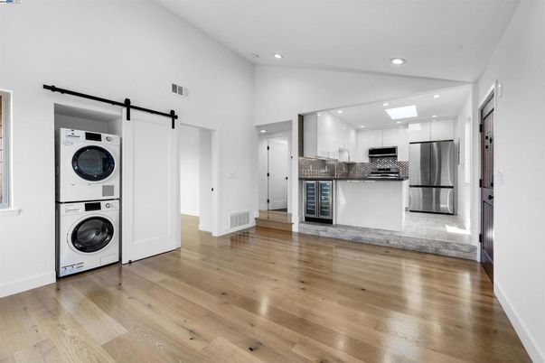 Interior, Kitchen, Recessed Lighting, Stainless Steel Appliances, Washer, Wood Texture Flooring