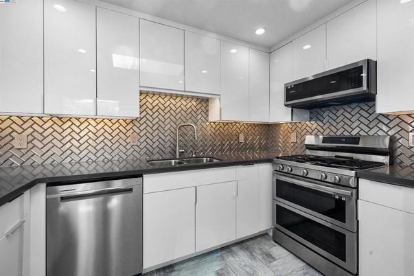 Interior, Kitchen, Recessed Lighting, Stainless Steel Appliances, Wood Texture Flooring