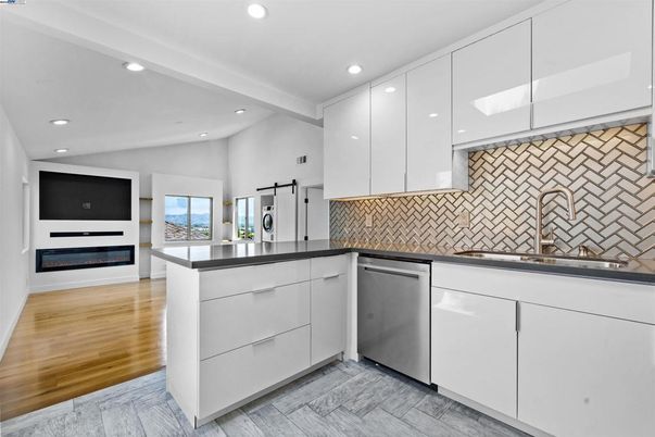 Fireplace, Interior, Kitchen, Recessed Lighting, Stainless Steel Appliances, Wood Texture Flooring