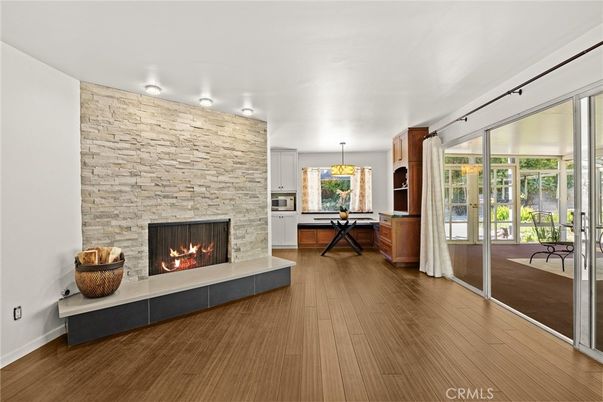 Chandelier, Dining room, Fireplace, Interior, Pendant Lights, Stone Walls, Wood Texture Flooring