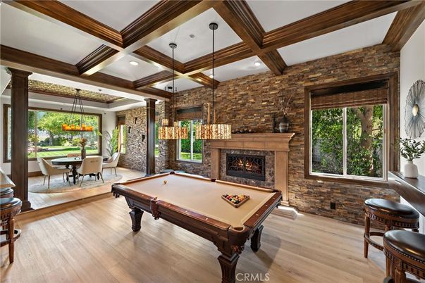 Billiard Table, Chandelier, Dining room, Fireplace, Game Room, Interior, Pendant Lights, Recessed Lighting, Stone Walls, Wooden Beams, Wood Texture Flooring
