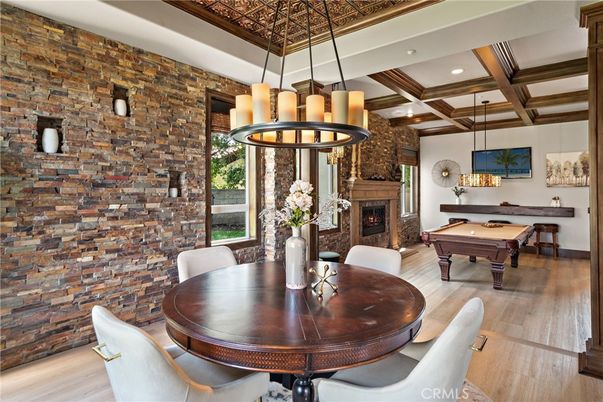 Billiard Table, Chandelier, Dining room, Fireplace, Game Room, Interior, Pendant Lights, Recessed Lighting, Stone Walls, Wooden Beams, Wood Texture Flooring