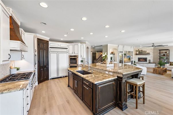 Fireplace, Interior, Kitchen, Living room, Recessed Lighting, Stainless Steel Appliances, Wood Texture Flooring