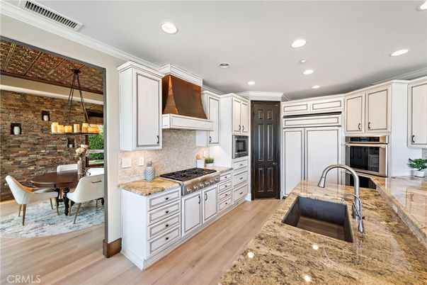 Dining room, Interior, Kitchen, Pendant Lights, Recessed Lighting, Stainless Steel Appliances, Stone Walls, Wood Texture Flooring