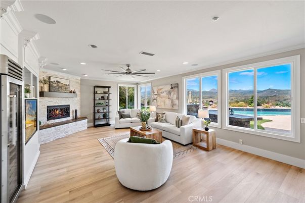 Fireplace, Interior, Living room, Recessed Lighting, Water, Wood Texture Flooring
