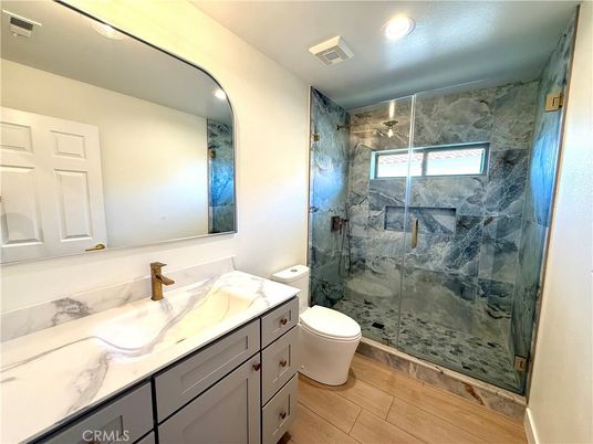 Bathroom, Glass Shower, Interior, Marble Walls, Recessed Lighting, Wood Texture Flooring