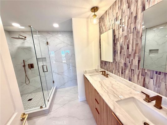 Bathroom, Dual Sink Vanities, Glass Shower, Interior, Marble, Marble Walls, Recessed Lighting
