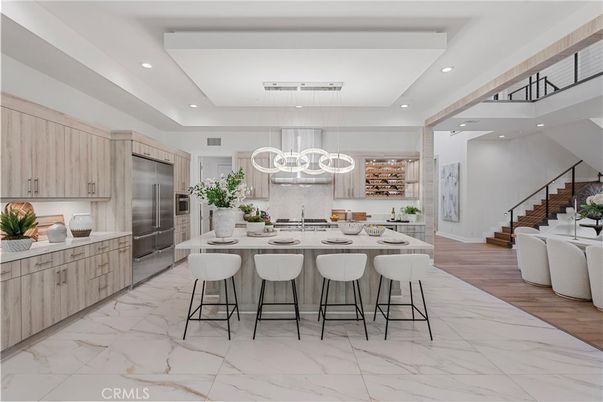 Chandelier, Interior, Kitchen, Marble, Pendant Lights, Recessed Lighting, Stainless Steel Appliances, Wood Texture Flooring