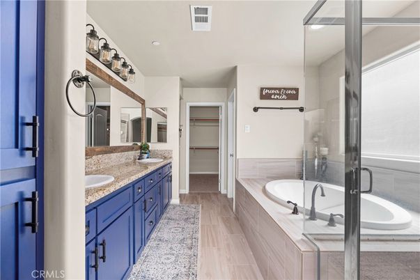 Bathroom, Dual Sink Vanities, Glass Shower, Interior, Recessed Lighting, Wood Texture Flooring
