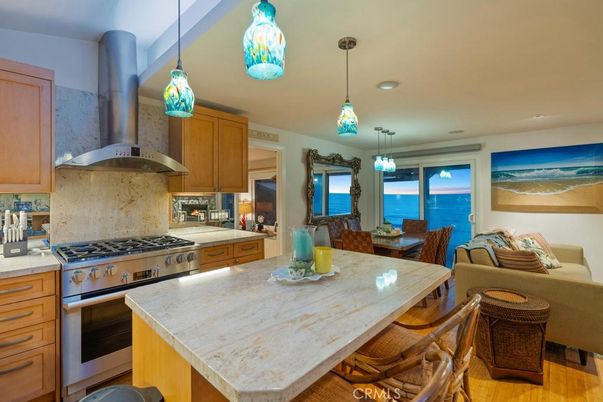 Dining room, Interior, Kitchen, Pendant Lights, Recessed Lighting, Stainless Steel Appliances, Water, Wood Texture Flooring