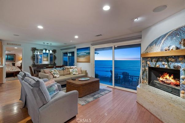 Dining room, Fireplace, Interior, Living room, Pendant Lights, Recessed Lighting, Water, Wood Texture Flooring