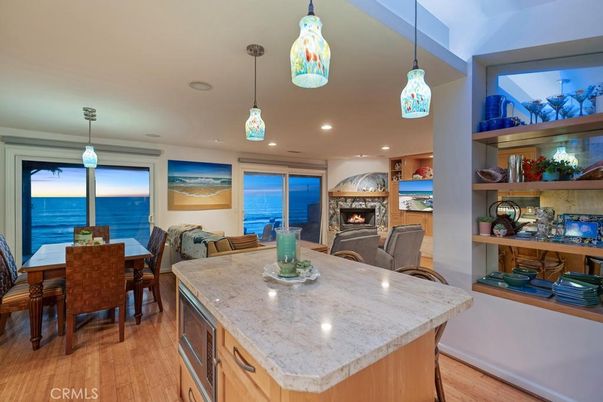 Dining room, Fireplace, Interior, Kitchen, Living room, Pendant Lights, Recessed Lighting, Water, Wood Texture Flooring