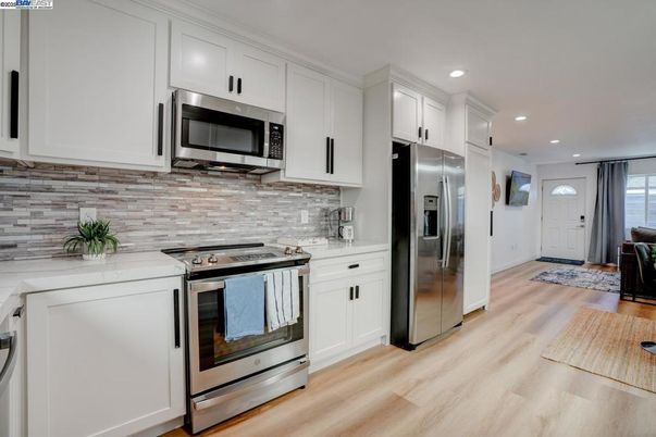 Interior, Kitchen, Recessed Lighting, Stainless Steel Appliances, Wood Texture Flooring