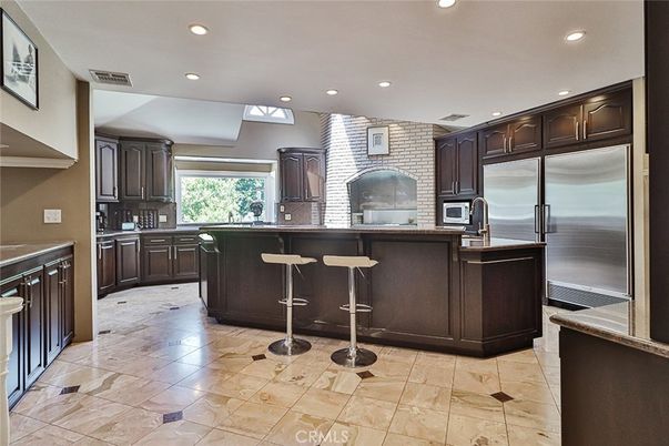 Interior, Kitchen, Recessed Lighting, Stainless Steel Appliances, Stone Walls