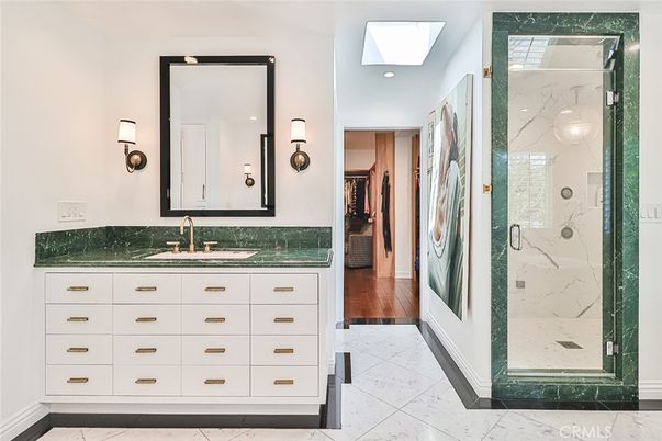 Bathroom, Dual Sink Vanities, Glass Shower, Interior, Marble, Marble Walls, Recessed Lighting, Wood Texture Flooring