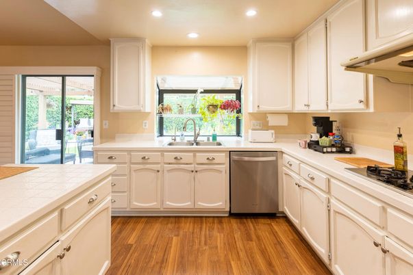 Interior, Kitchen, Recessed Lighting, Tile Countertops, Wood Texture Flooring