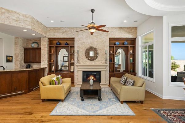 Fireplace, Interior, Living room, Recessed Lighting, Stone Walls, Wood Texture Flooring