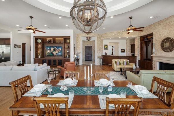 Chandelier, Dining room, Fireplace, Interior, Living room, Recessed Lighting, Stone Walls, Wood Texture Flooring
