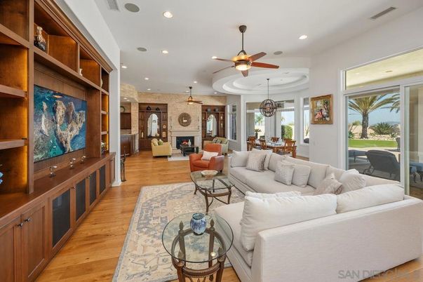 Dining room, Fireplace, Interior, Living room, Recessed Lighting, Stone Walls, Wood Texture Flooring
