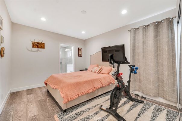 Bedroom, Fitness Equipment, Interior, Recessed Lighting, Wood Texture Flooring