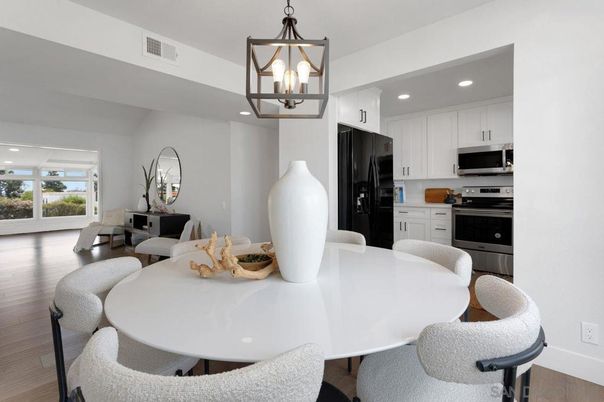 Dining room, Interior, Kitchen, Pendant Lights, Recessed Lighting, Stainless Steel Appliances, Wood Texture Flooring