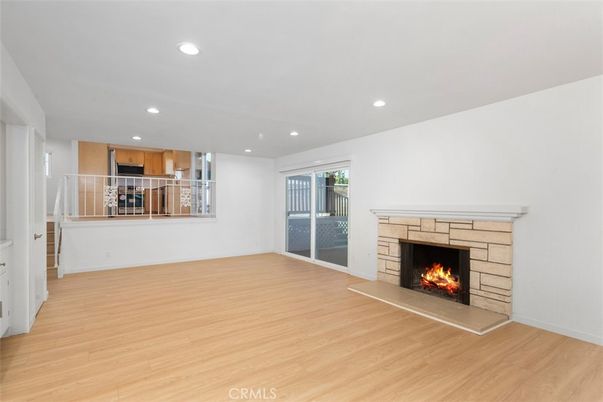 Empty room, Fireplace, Interior, Kitchen, Recessed Lighting, Wood Texture Flooring