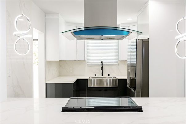 Interior, Kitchen, Marble Walls, Recessed Lighting, Stainless Steel Appliances