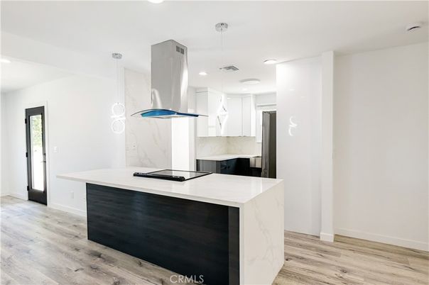 Interior, Kitchen, Marble Walls, Pendant Lights, Recessed Lighting, Wood Texture Flooring