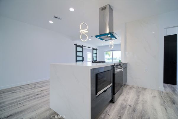 Interior, Kitchen, Marble Walls, Pendant Lights, Recessed Lighting, Wood Texture Flooring