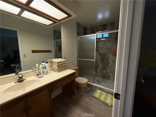 Bathroom, Glass Shower, Interior, Marble Walls, Wood Texture Flooring