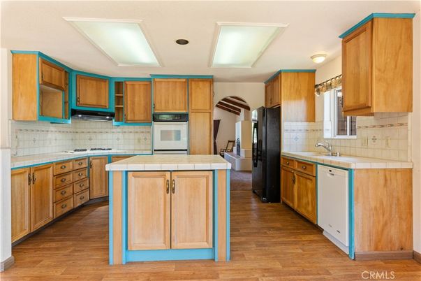 Interior, Kitchen, Recessed Lighting, Tile Countertops, Wood Texture Flooring