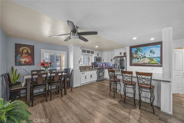 Dining room, Interior, Kitchen, Recessed Lighting, Stainless Steel Appliances, Wood Texture Flooring