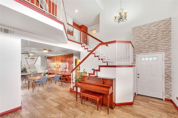 Chandelier, Dining room, Interior, Piano, Recessed Lighting, Stone Walls, Wood Texture Flooring