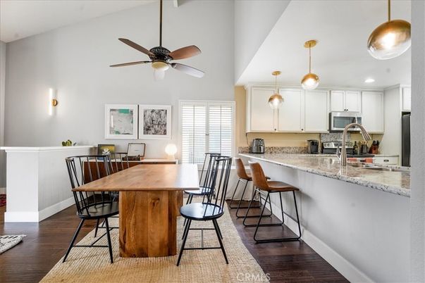 Dining room, Interior, Kitchen, Pendant Lights, Recessed Lighting, Stainless Steel Appliances, Wood Texture Flooring