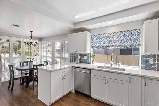 Chandelier, Dining room, Interior, Kitchen, Recessed Lighting, Stainless Steel Appliances, Wood Texture Flooring