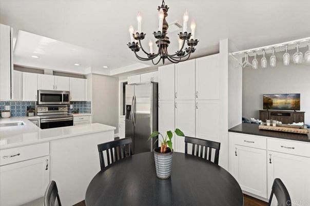 Chandelier, Dining room, Interior, Kitchen, Recessed Lighting, Stainless Steel Appliances, Wood Texture Flooring