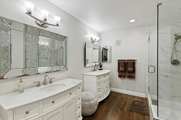 Bathroom, Dual Sink Vanities, Glass Shower, Interior, Recessed Lighting, Wood Texture Flooring