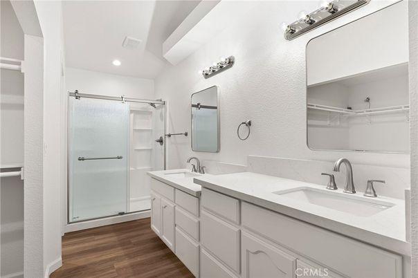 Bathroom, Dual Sink Vanities, Glass Shower, Interior, Recessed Lighting, Wood Texture Flooring