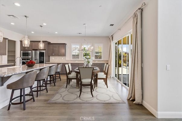 Dining room, Interior, Kitchen, Pendant Lights, Recessed Lighting, Stainless Steel Appliances, Wood Texture Flooring