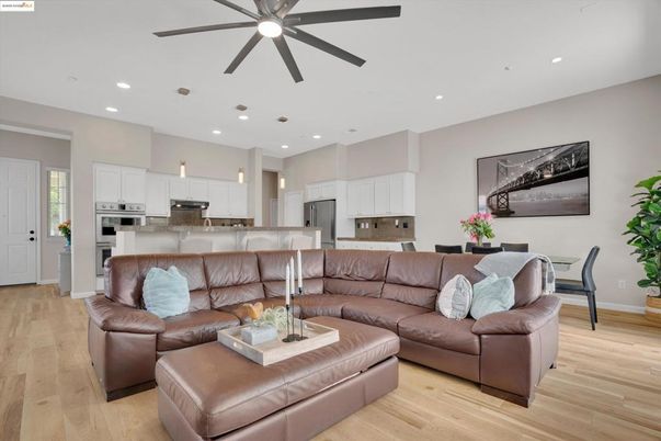 Dining room, Interior, Kitchen, Living room, Recessed Lighting, Stainless Steel Appliances, Wood Texture Flooring