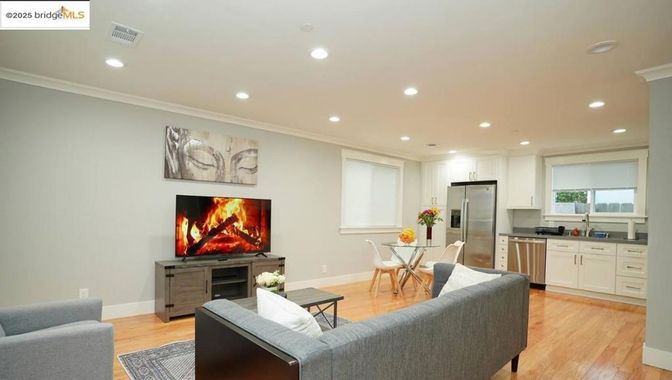Dining room, Interior, Kitchen, Living room, Recessed Lighting, Stainless Steel Appliances, Wood Texture Flooring