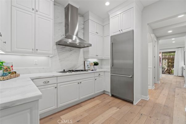 Interior, Kitchen, Marble Walls, Recessed Lighting, Stainless Steel Appliances, Wood Texture Flooring