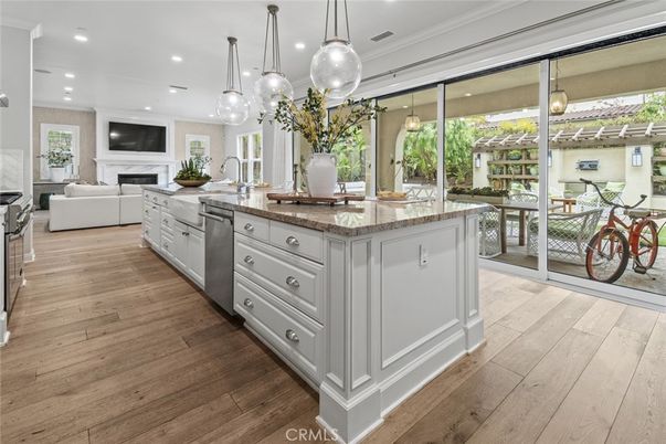 Fireplace, Interior, Kitchen, Living room, Pendant Lights, Recessed Lighting, Stainless Steel Appliances, Wood Texture Flooring