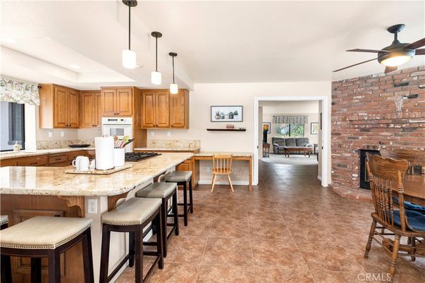 Fireplace, Interior, Kitchen, Pendant Lights, Recessed Lighting, Stone Walls